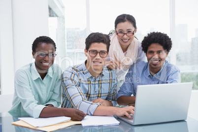 Casual business team working together at desk Casual business team working together at desk