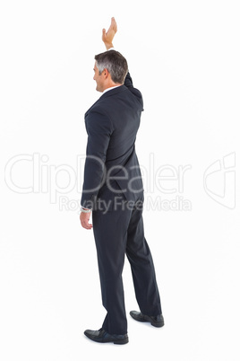 Isolated businessman in suit waving