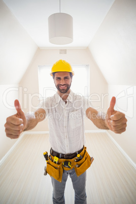 Handyman smiling at camera in tool belt