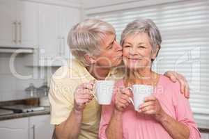 Senior couple having coffee together