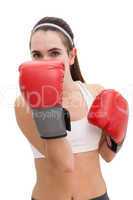Fit brunette in boxing gloves