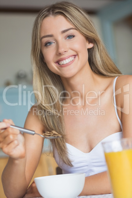 Cute blonde having her breakfast