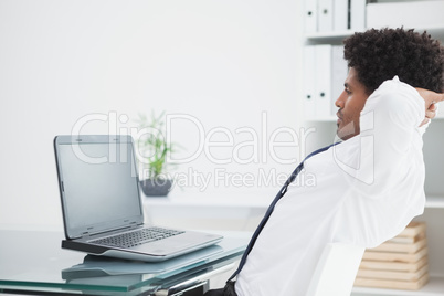 Relaxed businessman sitting on his chair