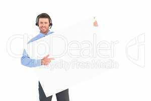 Businessman showing card wearing headset