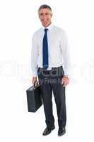 Smiling business man holding briefcase