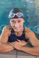 Portrait of female swimmer in pool at leisure center