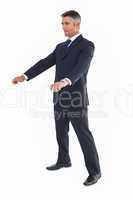 Businessman in suit with arms out