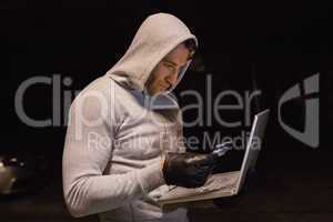 Man in hood jacket standing shopping online