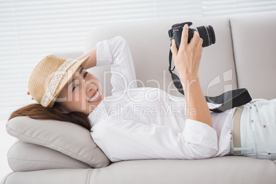 Photo editor looking at her camera
