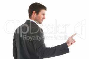 Serious businessman standing and pointing the finger