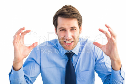 Annoyed businessman raising his hands