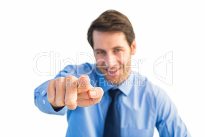 Friendly businessman pointing at the camera