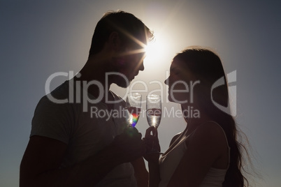 Cute couple toasting with champagne