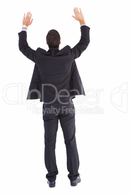 Businessman standing with hands up