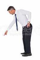 Businessman bending and pointing something down