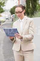 Young businesswoman using tablet pc