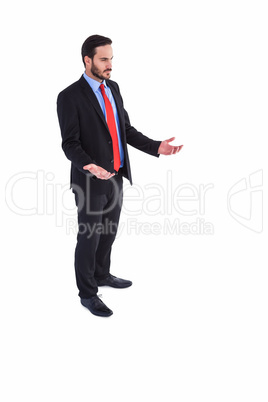 Focused businessman presenting with his hands