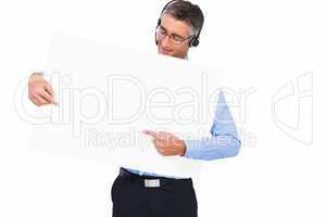 Businessman with headphone presenting a panel