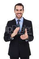 Happy businessman standing and applauding
