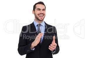 Happy businessman standing and clapping