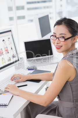 Photo editor working at her desk