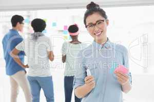 Young creative woman smiling at camera