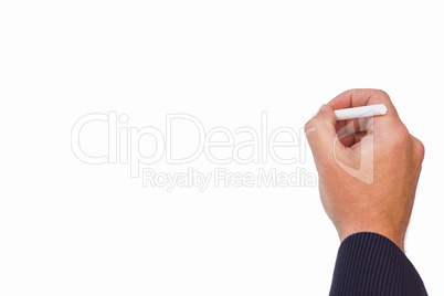 Hand of a businessman writing with a chalk