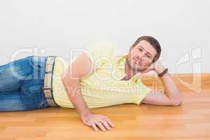 Man lying on floor at home