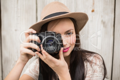 Pretty brunette taking a photo