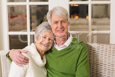 Portrait of smiling mature couple at table