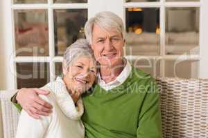 Portrait of smiling mature couple at table