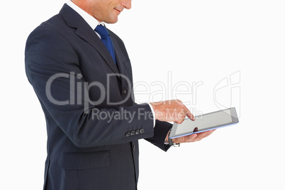 Businessman in suit using digital tablet