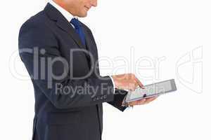 Businessman in suit using digital tablet
