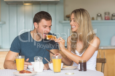 Cute couple having breakfast together