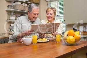 Senior couple having breakfast together