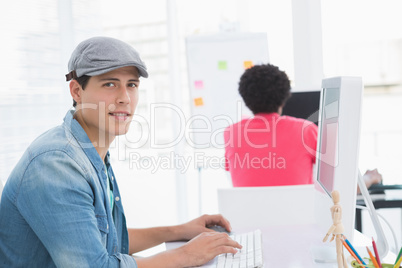 Young creative man working at desk