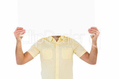 Man holding card in front of his face