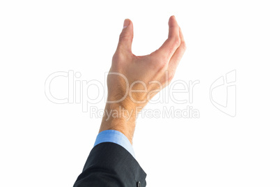 Businessman holding hand out in presentation