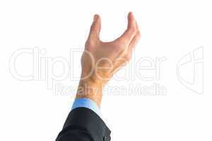 Businessman holding hand out in presentation