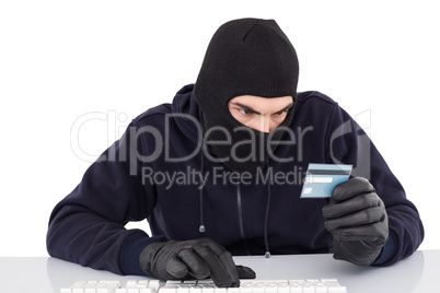 Focused burglar using computer and debit card