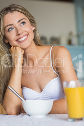 Cute blonde having her breakfast