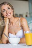 Cute blonde having her breakfast