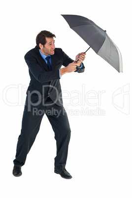 Man holding umbrella to protect himself from the rain