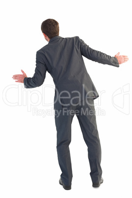 Businessman standing with hands out