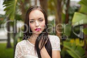 Pretty brunette hippie looking at camera