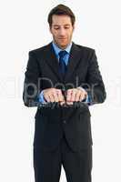 Businessman raising his clenched fists in front of him