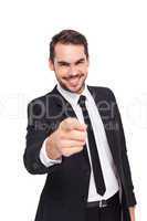 Happy businessman pointing at camera