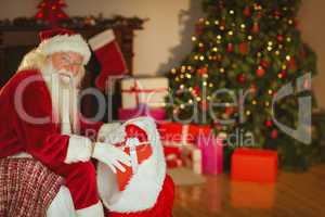 Smiling santa claus stocking gifts