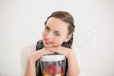 Pretty brunette preparing a healthy juice