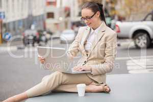 Young businesswoman using her laptop